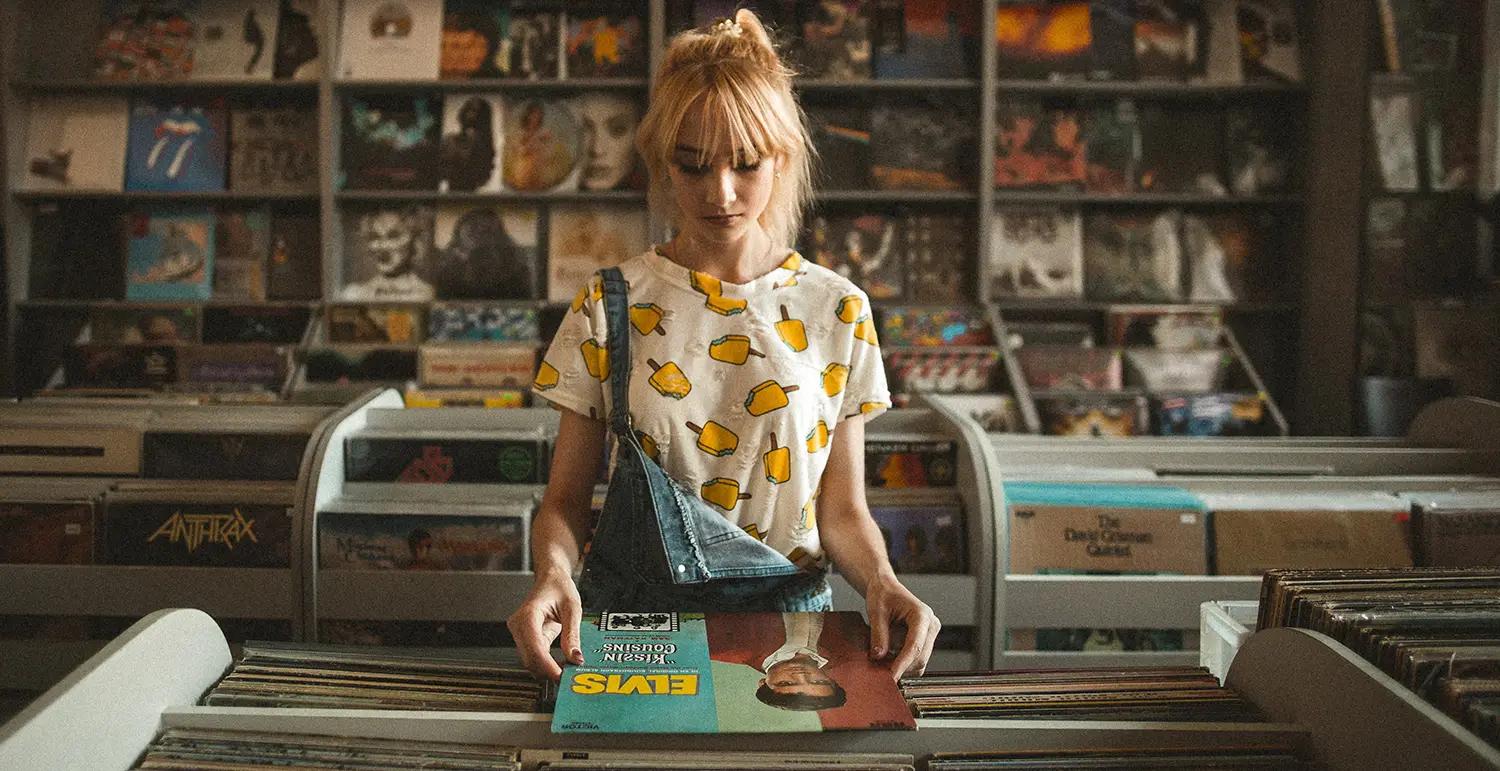 Girl looking at vinyls in a record store